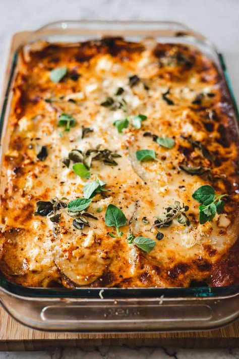 This Gluten Free Vegetarian Moussaka  Recipe is a traditional Greek recipe, made healthier. Layers of roasted eggplants, zucchini, and potatoes are layered with a homemade lentil tomato sauce, and topped with a gluten free béchamel sauce and a healthy sprinkle of cheese. This traditional  casserole is an unforgettable celebration of textures and flavors! Vegetarian Moussaka Recipe, Traditional Greek Moussaka Recipe, Veggie Moussaka, Vegetable Moussaka, Zucchini And Potatoes, Vegetarian Moussaka, Vegan Moussaka, Béchamel Sauce, Greek Recipe