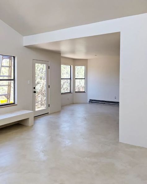 Micro Cement Interior, Cement Indoor Floors, Cement Floor Interior Design, Polished White Concrete Floors, Concrete Floor Baseboard, Concrete Salon Floor, Limewash Cement Floor, Concrete Floor House Interior Design, Micro Cement Kitchen Floor