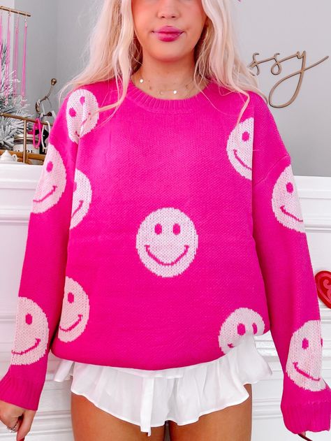 Our Miles of Smiles Hot Pink Sweater is a bright pink sweater featuring white smiley faces. This top has a relaxed and oversized fit making it super comfy! content: 100% acrylic care: hand wash, hang dry fit: oversized, relaxed, comfy Smiley Face Sweater, Bright Pink Sweater, Sassy Shortcake, Pink Smiley Face, Pink Smiley, Trendy Christmas Outfits, Hot Pink Sweater, Pull Rose, Hot Pink Tops