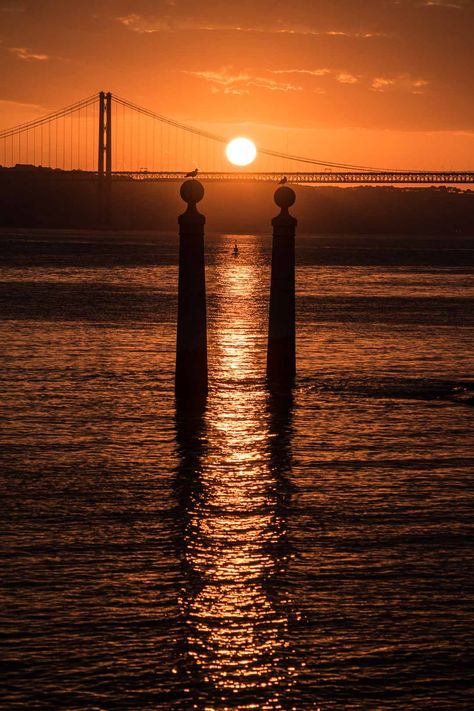 cais das colunas sunset lisbon. You spent the day exploring Lisbon, and you’re ready to experience the night life in Portugal capital city. But what are the best spots to watch the sunset in Lisbon? Well today I’m sharing my 30 best Lisbon sunset spots with you. One for every day of the month. lisbon portugal photography |  lisbon portugal things to do in  lisbon photography instagram | lisbon portugal travel photography Lisbon Instagram Spots, Lisbon Photo Spots, Lisbon Rainy Day, Lisbon Photography, Lisbon Beaches, Lisbon Portugal Photography, Portugal Sunset, Lisbon Sunset, Lisbon Sunset Spot