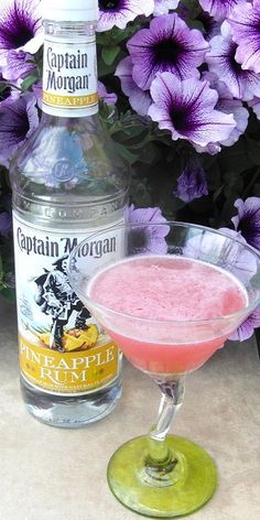 Jump the Shark 1 oz Captain Morgan Pineapple Rum 1 oz Captain Morgan Coconut Rum 1 oz Triple Sec 1 oz lime juice 1 oz Cranberry juice orange peel Shake all the ingredients over ice Strain into a co… Pineapple Rum Drinks, Malibu Rum Drinks, Amazing Drinks, Coctails Recipes, Mixed Drinks Alcohol, Pineapple Rum, Captain Morgan, Rum Drinks, Coconut Rum