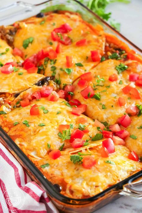 Dinner is easy with our beef enchilada casserole recipe! Layers of seasoned beef, cheese, and tortillas make this dish a family favorite Layered Beef Enchilada Casserole, Casserole With Tortillas, Beef Enchilada Casserole Flour Tortillas, Cheese Enchilada Casserole Easy, Ground Beef Mexican Casserole, Ground Beef Enchiladas, Stuffed Pepper Casserole, Easy Enchiladas, Enchilada Casserole Recipes