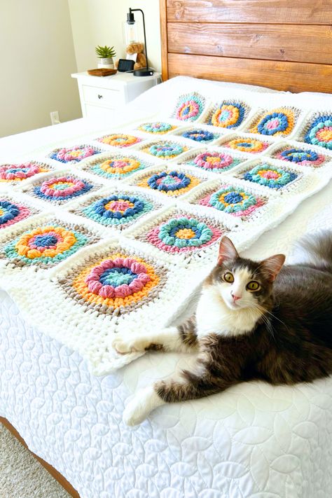 Free boho blossom flower crochet granny square blanket pattern. Beginner-friendly, cozy throw made with Bernat blanket super bulky yarn for home decor. Granny Square Blanket Pattern Free, Flower Crochet Granny Square, Crochet Granny Square Blanket Pattern, Granny Square Blanket Pattern, Square Blanket Pattern, Unique Throw Blankets, Bernat Blanket, Crochet Granny Square Blanket, Super Bulky Yarn