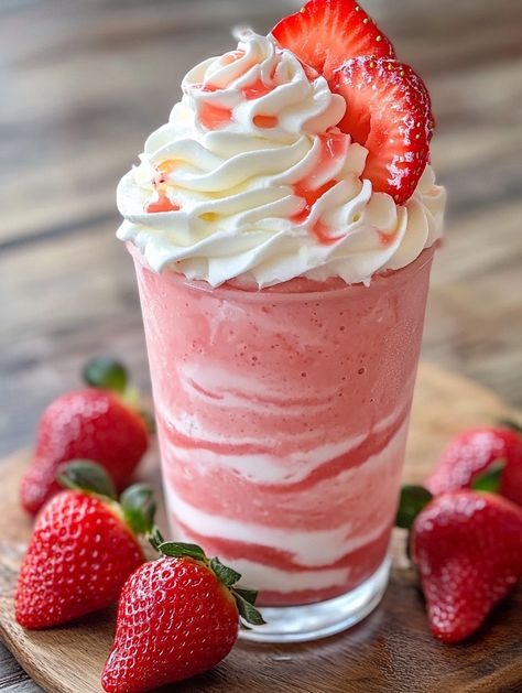 Strawberries & Cream Frappuccino 🍦  🍦 𝗜𝗻𝗴𝗿𝗲𝗱𝗶𝗲𝗻𝘁𝘀 🍦 For the Frappuccino Base 1 cup vanilla ice cream 🍦 1 cup whole milk 🥛 1 cup fresh strawberries, hulled and chopped 🍓 1/2 cup heavy cream 🥛 2 tablespoons granulated sugar 🍬 1 teaspoon vanilla extract 🍦 For the Whipped Cream: 1 cup heavy cream, chilled 🥛 2 tablespoons powdered sugar 🍬 1 teaspoon vanilla extract 🍦 For the Topping: Fresh strawberries, sliced 🍓 Strawberry syrup 🍓 Strawberry And Cream Frappuccino, Rival Darling, Strawberry Shortcake Drink, Milkshake Ideas, Strawberry Frappuccino, Sliced Strawberry, Milkshake Shop, Best Disneyland Food, Oreo Milkshake