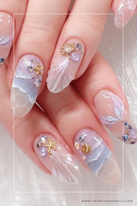 Make a splash this season with these mermaid-inspired nails! Choose from pink, purple, or blue gel or acrylic options, with short or long lengths and a variety of nail shapes. Add some bling to your fingertips and let your inner sea goddess shine with these Mermaid Nails Ideas! Nail Art With Crystals, Ocean Nail Art Sea, Water Nails Acrylic, Sea Shell Nail Designs, Ocean Gel Nails, Nails With Shells, Ocean Nails Designs, White Mermaid Nails, Mermaid Nails Acrylic