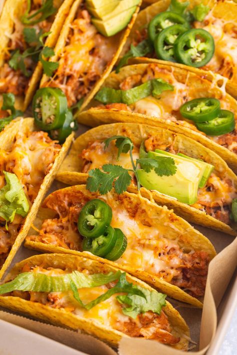 Baked chicken tacos are THE perfect taco night recipe. Quick and oh-so-easy, hard taco shells are stuffed with seasoned, shredded chicken, refried beans, tangy salsa, and shredded cheese, then baked until warm, melty, and deliciously crunchy. Seasoned Shredded Chicken, Taco Shell Recipe, Crunchy Taco Shells, Hard Shell Tacos, Shells Stuffed, Baked Chicken Tacos, Shredded Chicken Tacos, Chicken Baked, Taco Shells