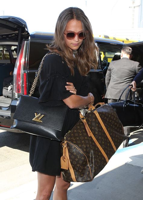 Prada and Louis Vuitton Were the Obvious Winners With Celebs This Week - PurseBlog Michael Fassbender And Alicia Vikander, Alicia Vikander Style, Louis Vuitton Bag Outfit, Vuitton Outfit, Louis Vuitton Outfit, Louis Vuitton Travel Bags, Louis Vuitton Travel, Lax Airport, Alicia Vikander