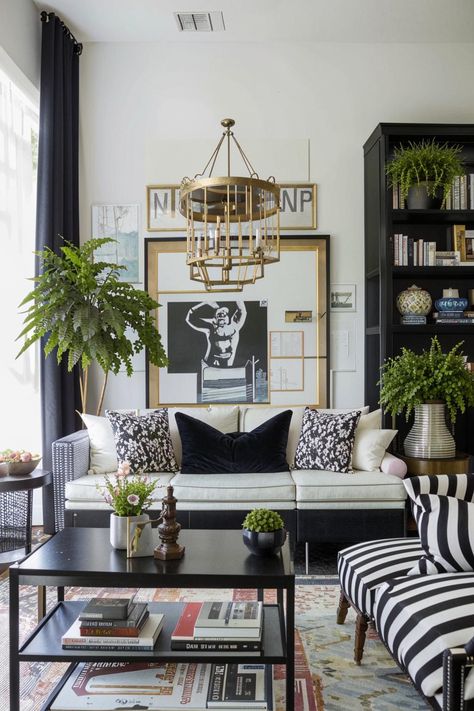 Elevate your living room with a timeless black and white palette. Add pops of vibrant color through throw pillows, artwork, or a statement rug to create a bold and inviting atmosphere. Black And White With Pop Of Color Decor Interior Design, Black And White With Pop Of Color Decor, Black And White Living Room Decor, Black And White Palette, Statement Rug, Color Decor, White Palette, Black And White Interior, Black And White Decor