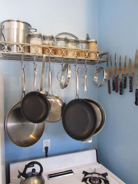 I love having my pots and pans hanging over the gas stove.  Grab and use.  Just need one more shelf above Kitchen Rail, Kitchen Rails, Pan Storage, Kitchen Tools Design, Rental Kitchen, Small Kitchen Storage, Practical Kitchen, Kitchen Organization Diy, Big Kitchen