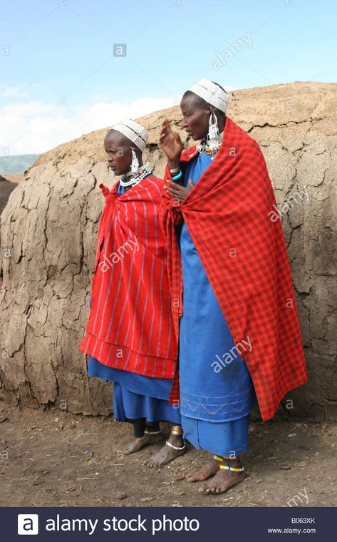 Download this stock image: Africa Tanzania Lake Eyasi two Maasai Women in traditional clothes and ornaments an ethnic group of semi nomadic people - B063XK from Alamy's library of millions of high resolution stock photos, illustrations and vectors. Women In Traditional Clothing, Warrior Dance, Masai Women, Masai Tribe, Warrior Images, Channel Outfits, Dance Background, Belly Dance Dress, Nomadic People