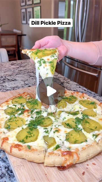 Taylor Jackzen on Instagram: "Do pickles belong on pizza? It’s a HECK YES for me! 🤤 I topped my dough with my favorite white sauce (ingredients below) followed by cheese, dill pickles, and fresh dill. Is it traditional? NOPE! Is it delicious? YEP! Share this post with the pickle lovers in your life and get the recipe below!  Ingredients:  For the Pizza Dough: 1 pound pizza dough (homemade or store-bought)  For the Sauce: 1/2 cup heavy cream 2 tablespoons butter 2 cloves garlic, minced 1/2 cup grated Parmesan cheese Salt and black pepper to taste  For Toppings: 2 cups shredded mozzarella cheese 1 cup sliced dill pickles 1/4 cup fresh dill, chopped (for garnish) Crushed red pepper flakes (optional, for added heat)  Instructions:   Preheat your oven to the temperature specified for your pizz Pickle Pizza With Garlic Sauce, Pizza Dough Homemade, Pickle Pizza, Pickled Garlic, Dill Pickles, Large Pizza, Homemade Pizza Dough, White Sauce, Crushed Red Pepper