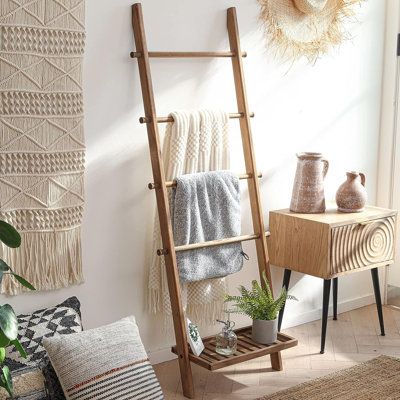 Crafted with skill and care by experienced artisans, this ladder is meticulously fashioned from 100% solid wood. Its robust construction makes it a reliable choice for hanging towels, blankets, throws, newspapers, and even light strings. | Loon Peak 5Ft Rustic Farmhouse Wooden Blanket Ladder w/ Bottom Shelf: Decorative Wall-Leaning Towel Rack | C100317981 | Wayfair Canada Ladder Blanket Holder, Ladder Hanger, Wood Blanket Ladder, Wooden Blanket Ladder, Blanket Holder, Bathroom Basement, Farmhouse Blankets, Blanket Rack, Vintage Ladder