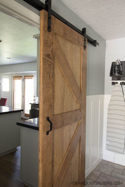 This beginner- friendly tutorial is a for two sided barn door with rustic decorative trim on both sides. Use wood boards from the big box store and birch plywood for a budget friendly project. This project lays out the steps to build a door of any size while still keeping the 1- 3/4" door width required by standard sliding barn door hardware. #sawdustsisters #barndoor #slidingbarndoor #doublesidedbarndoor Farm Doors, Build A Door, Building A Door, Building A Barn Door, Diy Sliding Barn Door, Barn Door Designs, Rolling Barn Door, Wood Boards, Rockler Woodworking