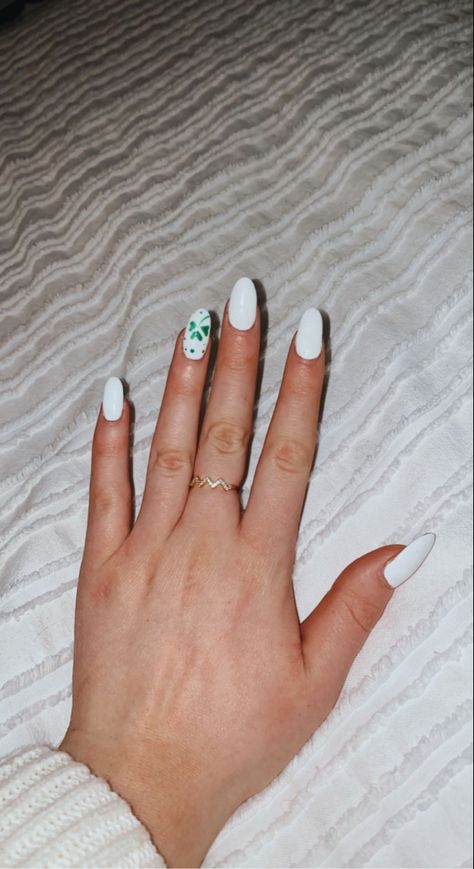 White acrylic St. Patrick's Day Shamrock almond shaped nails White St Patricks Day Nails, St Nails St Patrick, Saint Patrick’s Day Nails Almond, Minimal St Patricks Day Nails, St Patty’s Day Nails, Almond St Patrick Nails, Saint Pattys Day Nails, White And Green St Patricks Day Nails, Simple St Patricks Day Nails