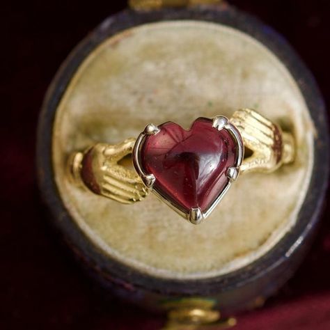 Gaetano Chiavetta on Instagram: "❤️🫶🏻❤️‍🔥😱 Inspired by the traditional Claddagh ring, this piece is crafted in 18 kt yellow gold, with a Sterling silver collet and set, at the centre, with a beautiful heart shaped garnet, in a cut down setting. The garnet at the centre measures 9x9 mm. Size: 7.1/4 Weight: 2.6 grams. Available here and now. Just please DM 😘 #gaetanochiavetta #heartring" Claddaugh Ring, Stone Flowers, Silver Claddagh Ring, Diy Jewelry Rings, Ring My Bell, Claddagh Ring, Claddagh Rings, Wrap Jewelry, Here And Now