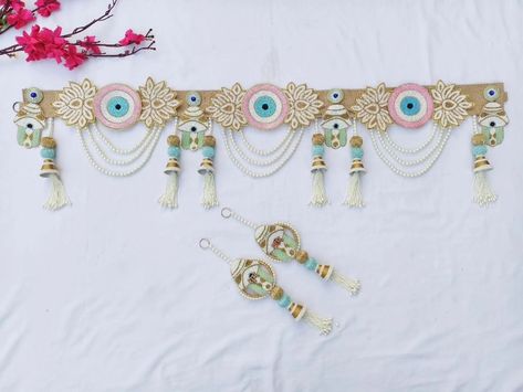 Trending Evil eye Bandhanwar with hamsa hand 🪬 on Jute base ✨✨ Bandhanwar with shubh labh DM us for more details or WhatsApp us on 9867422790 Evil Eye Bandarwal, Trousseau Packing, Hanging Flower Wall, Evil Eyes, Diwali Decorations, Hamsa Hand, Flower Wall, Evil Eye, Wall