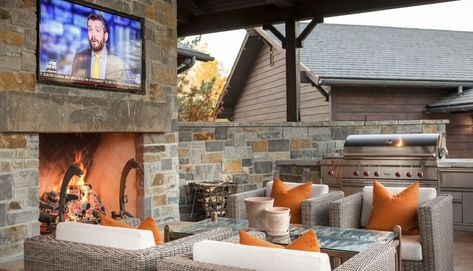 Barndominiums You Can't Wait to See Stone Fireplace Tv, Barndominium Pictures, Tv Niche, Wicker Patio Chairs, Gambrel Style, Luxury Ranch, Patio Fireplace, Kitchen Seating, Flagstone Patio