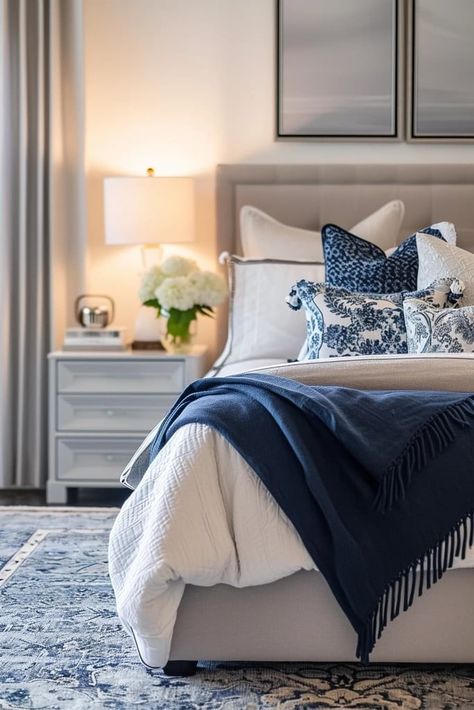 25 Navy Blue and Grey Bedroom Ideas We Love Cream Bedroom With Blue Accents, Bedroom With Navy Bedding, Blue White And Brown Bedroom, Navy Blue And Grey Bedroom Ideas, Blue Tones Bedroom, Navy Blue Bedroom Decor Ideas, Navy And Tan Bedroom, Beige And Navy Bedroom, Navy Master Bedrooms Decor