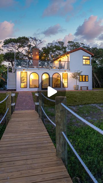 Jess Davis on Instagram: "✨Stay at The Shire✨ one of our 6 airbnbs in St Augustine FL available to book now Voted one of Condè Nests Favorite Vacation Homes in America’s Most Beautiful Small Towns When you visit St. Augustine, you probably are expecting ocean views and gorgeous Spanish architecture-and this two-bedroom house just so happens to provide both. The Shire is a 1930s eclectic home nestled in nature, with charming decor and history, featuring red roof tiles outside and vaulted pecky cypress ceilings inside, while the rooftop deck (covered with string lights, of course) provides unparalleled views of the marshlands and Atlantic Ocean. The large arch doors lead to a private dock sitting on two acres of marsh where you can enjoy dinner and even catch it if you’re lucky. There’s Beach House With Rooftop Deck, House With Rooftop Deck, Red Roof Tiles, Arch Doors, Roast Marshmallows, Pecky Cypress, Two Bedroom House, Watch The Sunset, Private Dock