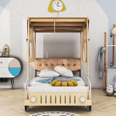 This bed is in the shape of a car and will bring fun to your room. The footboard contains a book storage shelf and LED lights to bring convenience to your life. Soft pillow for you to bring a comfortable experience. Size: Twin | Harriet Bee Wooden Car-Shaped Platform Bed w / LED & Pillows 62.0 H x 42.0 W x 79.0 D in brown / whiteWood & Upholstered / in Brown;natural | Twin | Wayfair Pole Room, Bed Bookshelf, Wooden Platform Bed, Full Bed Frame, Solid Wood Platform Bed, Car Bed, Wooden Car, Metal Platform Bed, Soft Pillow