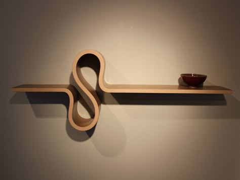 The S Shelf by Kino Guerin in Quebec with  clean simple elegant curves.  Handcrafted from walnut veneer over bent 8 layer ply.  Available at Kozai Modern $960  #homedecor #shelf Bent Wood Projects, Curved Shelves, Glass Wood Table, Cnc Furniture Plans, Law Office Decor, Bent Plywood, Townhouse Interior, Furniture Design Sketches, Moody Decor