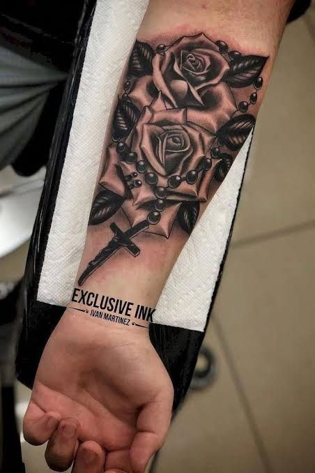 https://encrypted-tbn0.gstatic.com/images?q=tbn:ANd9GcTUb6-qKtAkCb1LCpZ3S_HvGjSPyQZRBosJ8A&usqp=CAU Bead Tattoo, Tattoo Lyrics, Rose Tattoo Forearm, 42 Tattoo, Tattoo Man, Rose Tattoos For Men, Tattoos Mandala, Forarm Tattoos, Omerta Tattoo