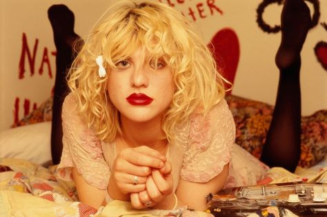 Slideshow: Courtney Love’s Evolving Style Through the Years #kinderwhore #baby-doll Courtney Love, Red Lipstick, Blonde Hair, A Woman, Guitar, Blonde, Bed, Red, Hair