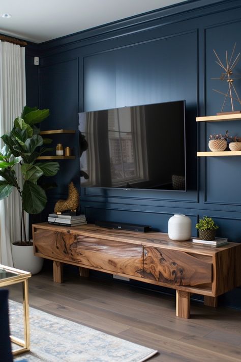 Upgrade your entertainment area with sleek, modern TV wall ideas. Click here to see more. Navy Living Room Accent Wall, Navy Blue Accent Wall Living Room Tv, Navy Living Room Accents, Accent Tv Wall, Blue Accent Wall Living Room, Navy Living Room, Wooden Media Console, Tv Wall Ideas, Navy Living