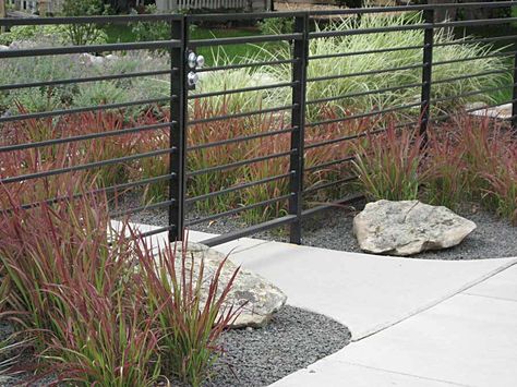 modern metal fence with horizontal lines Iron Fencing Ideas, Ornamental Fence Ideas, Modern Iron Fence, Low Black Fence Front Yard, Modern Wrought Iron Fence, Black Metal Fencing, Metal Horizontal Fence, Horizontal Iron Fence, Black Iron Fence