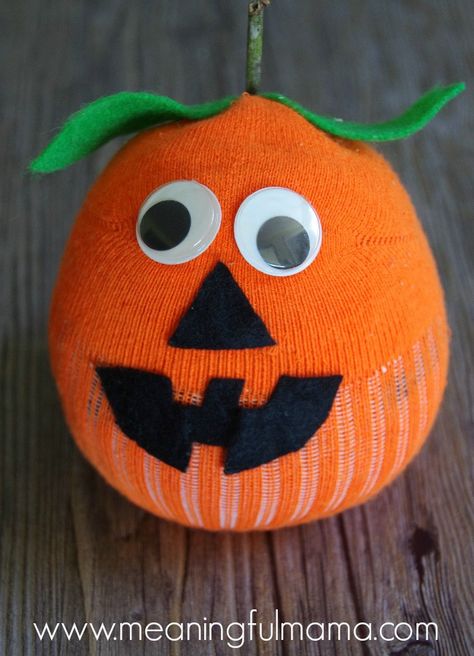 Sock Pumpkin Craft - Great Fall, Harvest or Halloween Jack-O-Lantern Craft for Kids #halloween #halloweencraft #pumpkin #pumpkincraft #jackolantern Pumpkin Sock Craft, Easy Stuffed Pumpkin Craft, Ghost Sock Craft, Recycled Pumpkin Project, Pumpkin Plush Diy, Lantern Crafts For Kids, Pumpkin Socks, Sock Snowman Craft, Lantern Crafts