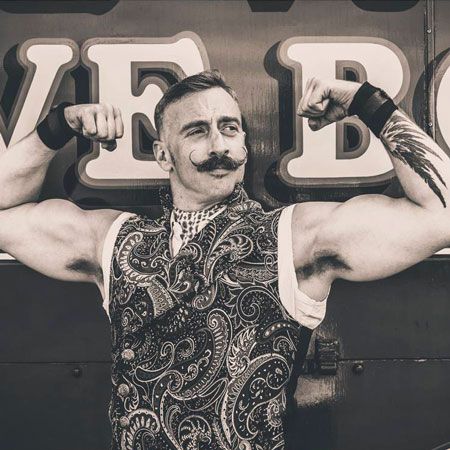 The Vintage Strongman is a strapping young moustachioed chap and a true gentleman. Eager to demonstrate his incredible strength with a genuine live performance of bending metal and lifting people, the Vintage Strongman will also educate young men on the necessary attributes of becoming a proper gentleman. His Victorian sideshow-style performance is laced with quips, strength skills, themed attire, good humour and audience participation. Vintage Strongman, Wrestling Clothes, Circus Strongman, Vintage Muscle Men, Vintage Circus Posters, Creepy Carnival, Halloween Circus, Circus Poster, Circus Costume