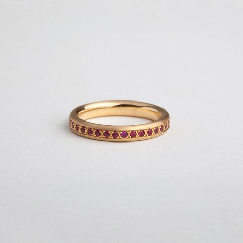 A beautiful full eternity ring with an oval profile made in 18k gold. Wear it as a stacking ring or an engagement Band, or match it with a wedding ring. Traditionally set with 0.55 Ct Red Rubies to create a piece of jewelry that sparks and is comfortable and classy.  Our eternity rings are characterized by a bold setting, creating a Gobelin-like ornament. Stacked together in multi layers they make a wonderful, colorful texture. You're free to choose the colors and the combinations.  Stones: Natu Band Rings Women, Colorful Texture, Ruby Bands, Lapis Lazuli Jewelry, Eternity Rings, Stack Ring, Full Eternity Ring, Engagement Band, Jewelry Lookbook