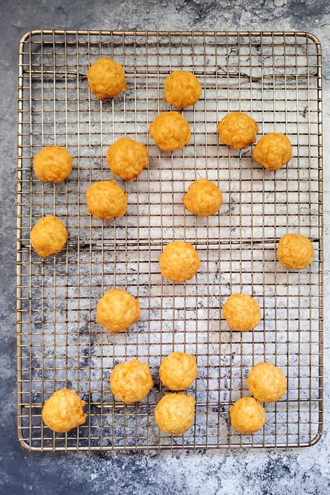 Mom's Cheese Olive Puffs Recipe Olive Stuffed Cheese Balls, Cheese Olive Balls, Olive Cheese Puffs, Cheese Puffs Recipe Appetizers, Olive Cheese Balls, Olive Puffs, Freezing Cheese, Cheese Puffs Recipe, Food Rocks