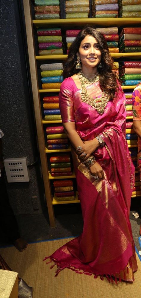 Shriya Saran in a pink pattu saree at shop opening Tomato Pink Saree Contrast Blouse, Rani Pink Pattu Saree, Dark Pink Pattu Saree, Jewellery For Pink Saree, Pink Pattu Blouse Designs, Pink Pattu Saree Contrast Blouse, Onion Pink Saree Contrast Blouse, Pink Saree Contrast Blouse, Pink Bridal Saree