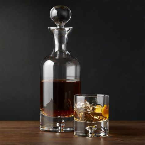 We've added this beautiful decanter to our popular Direction barware collection. Topped with a large round stopper, the gracefully shaped decanter features the line's signature open bubble in the sham. Crafted by skilled artisans in Poland, the decanter is made of crystalline glass for exceptional clarity.    Handcrafted   Crystalline glass   37 oz.   Hand wash   Made in Poland Whiskey Accessories, Whisky Decanter, Electric Wine Opener, Whiskey Gifts, Hummingbird Feeder, Whiskey Decanter, Decanter Set, Humming Bird Feeders, Groomsmen Gifts