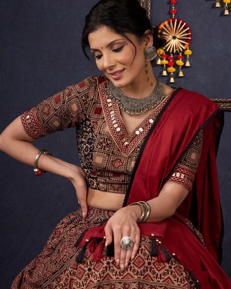 Indulge in the luxurious and exclusive world of fashion with our Elegant Maroon & Black Ajrakh Lehenga. Adorned with intricate Ajrakh print, this stunning lehenga comes with a matching blouse and dupatta, creating a timeless and elegant ensemble. Embrace sophistication and elevate your style with this beautiful piece. #sujatra #sujatraglobal #sujatralehenga #readymadelehenga #stitchedlehengacholi #lehengacholi #ajrakhprints #ajrakhlehenga #lehengalove Ajrakh Lehenga, Ajrakh Prints, Lehenga Choli, World Of Fashion, Lehenga, Wedding Decor, Elevate Your Style, Wedding Decorations, Return Policy