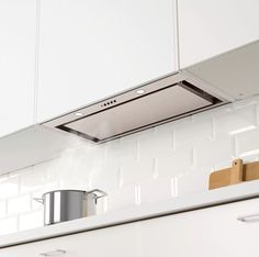 Kitchen Design Idea - Hide The Range Hood | A fake cabinet conceals this range hood that can only be seen when looked at from underneath. Kitchen Extractor Fan Ideas, Mural Installation, Kitchen Extractor Fan, Kitchen Extractor, Kitchen Vent Hood, Kitchen Cooker, Kitchen Vent, Kitchen Exhaust, Hidden Kitchen