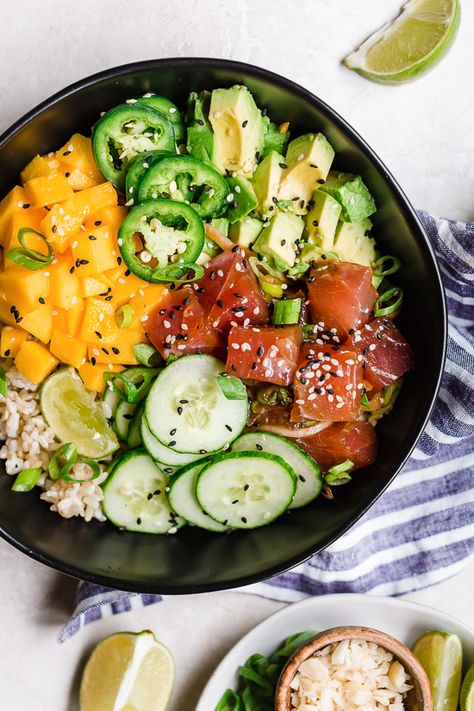 With marinated tuna, brown rice, avocado, cucumber, mango, macadamias and scallions, this Hawaiian style quick-cook Ahi Poke Bowl is perfect for hot summer nights. Shrimp Stacks, Ahi Poke Bowl, Spicy Tuna Poke, Marinated Tuna, Cucumber Mango, Rice Avocado, Ahi Tuna Poke, Stuffed Avocados, Tuna Poke Bowl