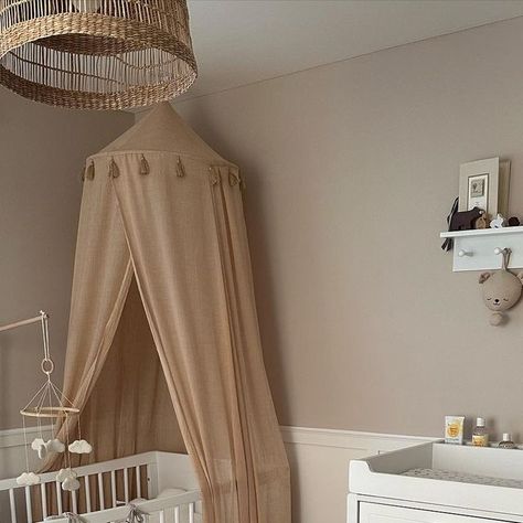 Lucy 🤍 on Instagram: "Nursery 🧸✨☁️🤎

The room I couldn’t wait to decorate when I was pregnant is now the room I dread Rudy actually sleeping in 😆 as I just couldn’t imagine him not being right next to me in his little crib 🥺

Cot @snuzuk 
Cot canopy @mabelandfox 
Cot organiser @amazon 
Playmat @hm 
Wooden Toys @little_stories_uk 
Rug @beliani_uk 
Changing table @snuzuk 
Shelf @johnlewis 
Lampshade @amazon 
Curtains and blinds @blinds2go 
Paint @duluxuk Gentle Fawn

#beigenursery #neutralnursery #neutralbedroom #babyroomdecor #nurseryinspo #beigeaesthetic #beigepalette #babyroomdecoration #babyroominspro #pregnancyjourney #mumvlogger #newmum #mumtobe #myneutralnursery #cloudnursery #babyroom #firsttimemum #panelling #nurserypanelling #nursingchair #bouclechair" Cot With Changing Table, Cot Organiser, Cot Canopy Nursery, Snuz Cot, Leander Cot, Amazon Curtains, Cot Canopy, Imagine Him, Beige Nursery