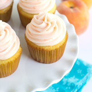 Yellow Cupcakes with Peach Cream Cheese Frosting - Light and fluffy homemade yellow cupcakes topped with a peach flavored cream cheese frosting! Perfect for all occasions! Flavored Cream Cheese Frosting, Flavored Cream Cheese, Peaches Cream Cheese, Flavored Cream Cheeses, Yellow Cupcakes, Oreo Cupcakes, Peach Cream, Cupcake Flavors, Pretty Dessert