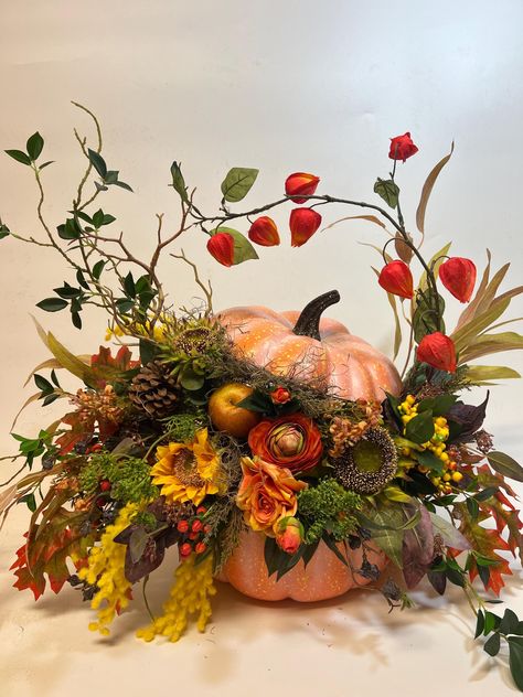 Beautiful unique large artificial fall arrangement  a real show stopper! Made with, berries, roses, chrysanthemums, greenery, pine cones, sunflowers, moss about 24"  wide and 20" tall and  18 " in diameter Foam Pumpkin Floral Arrangement, Artificial Pumpkin Centerpieces, Large Autumn Floral Arrangements, Unusual Floral Arrangements Ideas, Fall Vase Decor, Harvest Centerpieces, Autumn Floral Arrangements, Halloween Florals, Fall Living Room Ideas