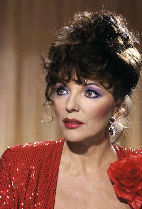 Dynasty face 80s makeup: Joan Collins wearing purple eyeshadow in Dynasty Alexis Colby, 80’s Makeup, Denver Clan, 1980s Makeup, Alexis Carrington, Dame Joan Collins, 80s Makeup, Nolan Miller, Fashion Decades