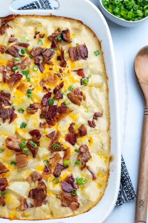 Loaded Baked Potato Casserole is PERFECT for game day, made with russet potatoes baked in a cheesy sauce with spices and onions, then topped with crispy bacon and served with sour cream. #bakedpotato #loadedbakedpotato #glutenfree #easyrecipe #gamedayrecipe Bread Bowl Soup, Loaded Baked Potato Casserole, Potatoes Baked, Baked Potato Casserole, Loaded Baked Potato, Gluten Free Sides Dishes, Loaded Baked Potatoes, Cheesy Sauce, Bread Bowls