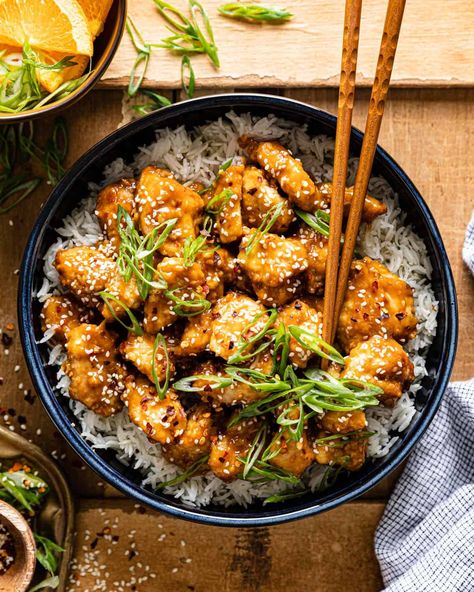 This Orange Chicken (Air Fryer) is the easiest weeknight dinner and it is much tastier (and healthier) than takeout. The lightly breaded crispy chicken is tossed in the most vibrant orange soy flavored sauce. Serve this air fryer orange chicken over steamed or fried rice and dinner is served! Orange Chicken Air Fryer, Air Fryer Orange Chicken, Chicken Air Fryer, Orange Chicken Sauce, Ninja Grill, Easy Chicken Breast, Chicken Breast Recipes Easy, Ninja Recipes, Healthy Chicken Breast