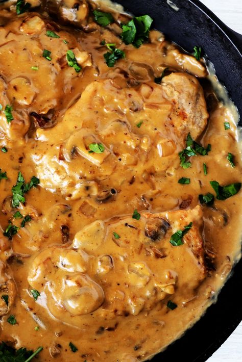 A close up, overhead shot of pork chops with mushroom gravy in cast iron pan. Pork Chops With Mushroom Gravy, Pork Chop Brine, Boneless Pork Loin Chops, Mushroom Pork Chops, Easy Pork Chops, Pork Chop Recipes Baked, Pork Chop Dinner, Boneless Pork Loin, Pork Loin Chops