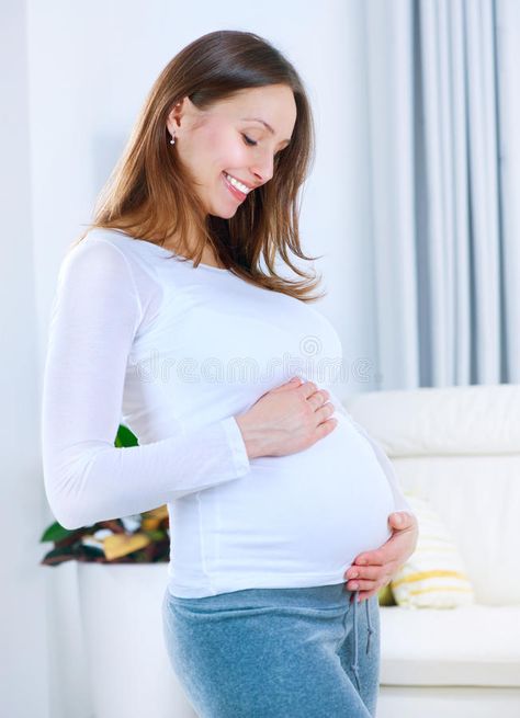 Pregnant Young Woman. At home. Happy Pregnancy , #AD, #Woman, #Young, #Pregnant, #Pregnancy, #Happy #ad Women Images, Happy Pregnancy, High Risk Pregnancy, Pediatric Dentist, Plus Size Pregnancy, Womens Health, Pregnant Women, How To Stay Healthy, Stock Images Free