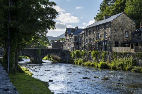 Afon Colwyn, Gwynedd, Wales, is a tributary of the Afon Glaslyn. It has its source on the south-western flank of Snowdon. It first flows west to Beddgelert road at Pont Cae'r Gors, just south of Rhyd Ddu, then flows south to Beddgelert. On the way it is joined by two tributaries, Afon Cwm-du and Afon Meillionen. At Beddgelert it joins the Glaslyn to then flow south to Tremadog Bay near Porthmadog. Gwynedd Wales, Colwyn Bay, Visit Wales, Wales, The Way, Road, House Styles, Nature