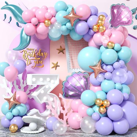 PRICES MAY VARY. 🌟 104 Pcs Mermaid Balloon Garland Arch Kit - You will get 104pcs party balloons, include teal blue balloons (1 x 18", 8 x 12", 10 x 10", 6 x 5"), pastel pink balloons (8 x 12", 10 x 10", 6 x 5"), macaron purple balloons(1 x 18", 8 x 12", 10 x 10", 6 x 5"), metallic gold balloons (8 x 5"), transparent balloons (2 x 12", 3 x 10", 3 x 5"), 2 x 18" mermaid tail balloons, 2 x shell foil balloons, 3 x 10" rose gold star balloons, 40pcs glue dot, 5m balloon chain(1 roll). 🌟 Non-toxic Girls Mermaid Party, Ocean Theme Birthday, Mermaid Balloons, Transparent Balloons, Mermaid Party Decorations, Balloon Chain, Purple Balloons, Mermaid Theme Party, 10th Birthday Parties