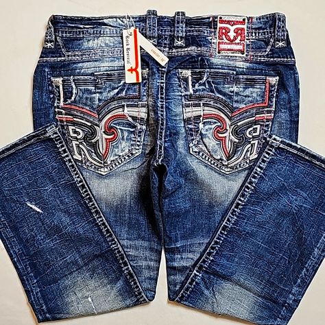 Rock Revival Clyde Distressed Straight Leg Jeans. (Last Pair) Authentic. Men's Size: Waist 40x32 Inseam. Rise: 11.5in. Bottom Leg Width 9.5in. Color: Medium Blue. Materials: 99% Cotton; 1% Elastane-Stretch. Cut: Straight. Details: Single Button Zip Front. (6) Pockets. Embroidered. Heavily Stitched. Nwt In Package. No Flaws. No Trades. ~Please Ask For Additional Information~ Rock Revival Jeans Mens, Distressed Straight Leg Jeans, Grey Trench Coat, Brown Jeans, Adidas Track Suit, Jean Pockets, Swim Shoes, Rock Revival Jeans, Compression Pants