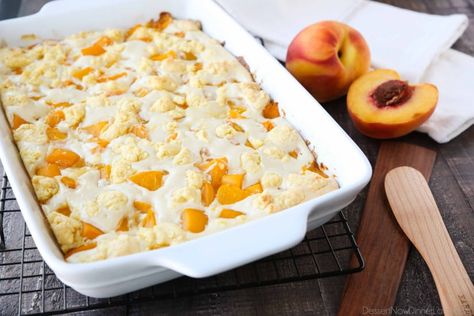 Peach cobbler meets cheesecake in this delicious dessert duo! An easy and unique twist from a traditional peach cobbler. There's cake mixture on bottom and on top, with peaches and cheesecake in-between. Peach Cobbler Recipe With Cake Mix, Dessert Duo, Peaches And Cream Recipe, Peaches And Cream Dessert, Crockpot Peach Cobbler, Peach Cobbler Cake, Peaches Cream Cheese, Cake Mix Cobbler, Easy Peach Cobbler Recipe